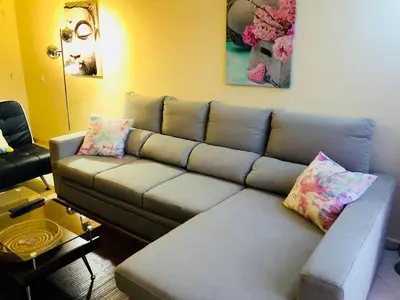 a living room with a couch and a table at Albufeira Luxury Villa in Albufeira