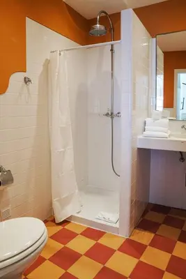 a bathroom with a shower and a toilet at Breathtaking BeachFront House in Albufeira