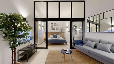 a living room with a couch and a table at Apartamento T0 MFA, 400m Praia dos Pescadores in Albufeira