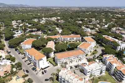an aerial view of a campus with buildings at NEW! Vilamoura Garden View in Quarteira