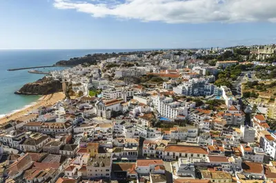 an aerial view of a city and the ocean at Downtown 1 Bedroom Apartment E - 150m from the Beach in Albufeira