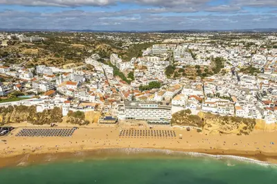 an aerial view of a beach and buildings at Downtown Studio Apartment G - 150m from the Beach in Albufeira
