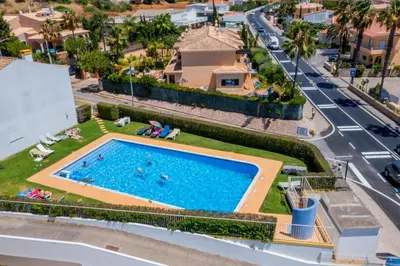an overhead view of a swimming pool on a city street at Sunset Villa No 19 in Galé