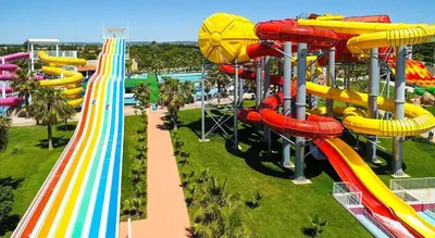a roller coaster in a park with a slide at Marina Vilamoura - Aquamar 205 - 3 Quartos in Quarteira