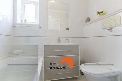 a white bathroom with a toilet and a sink at #320 Quinta da Correeira 55 by Home Holidays in Vale de Pedras