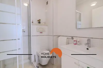 a bathroom with a toilet and a sink and a mirror at #320 Quinta da Correeira 55 by Home Holidays in Vale de Pedras