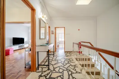 a living room with a desk and a mirror at BeGuest Dream House in Loulé