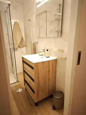 a bathroom with a sink and a toilet and a shower at Charmoso T1 Varandas de Malpique in Albufeira