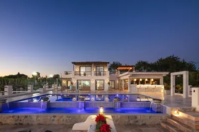 a large house with a swimming pool at night at Villa Avalon - Bedzy Luxury in Almancil