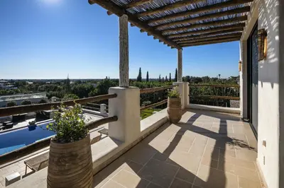 a balcony of a house with a view at Villa Avalon - Bedzy Luxury in Almancil
