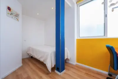 a room with a table and a window at Encanto da Ria in Faro
