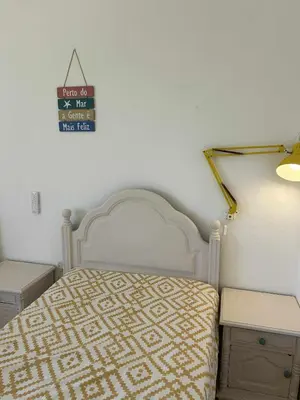 a living room with a couch and a table at Casa da Praia em Olhos de Água a 50 metros da Praia in Olhos de Água