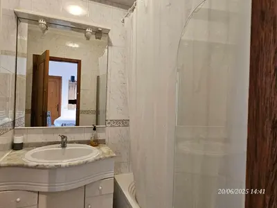 a bathroom with a sink and a shower with a mirror at Blife Candya private apartment in Monte Negro