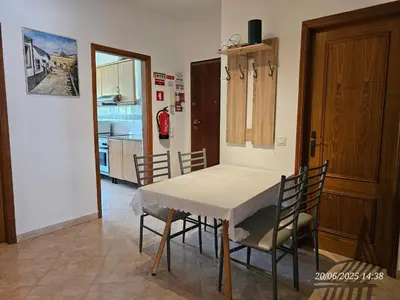 a kitchen and dining room with a table and chairs at Blife Candya private apartment in Monte Negro