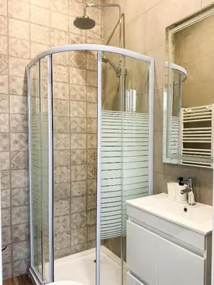 a bathroom with a shower and a sink at Sao Pedro Guest House in Faro