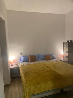 a bedroom with a bed with two pillows on it at Guest House Mercado in Faro