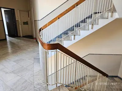 a staircase in a house with a tile floor at Blife Osonya - private rooms at Santantonya 4th floor in Faro