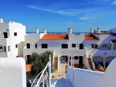 a view of a white building with red roofs at Casa Mar Sol E Sossego in Albufeira