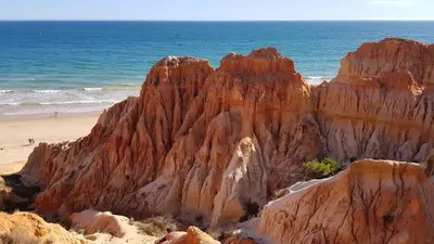 a large rock formation on a beach next to the ocean at Vila Candeias, Vilamoura, Algarve, Beach, 10p in Quarteira