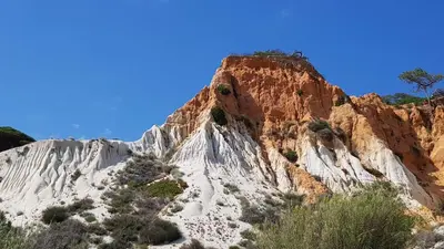 a rocky mountain with trees on top of it at Vila Candeias, Vilamoura, Algarve, Beach, 10p in Quarteira
