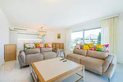 a living room with two couches and a table at Prime Luxury Apartment by Atlantic Places in Albufeira