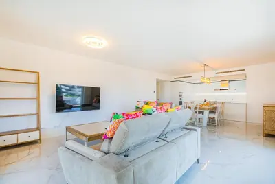 a living room with a couch and a table at Prime Luxury Apartment by Atlantic Places in Albufeira
