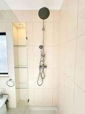 a bathroom with a shower with a tub at Villa Brasil by BeCherish in Quarteira