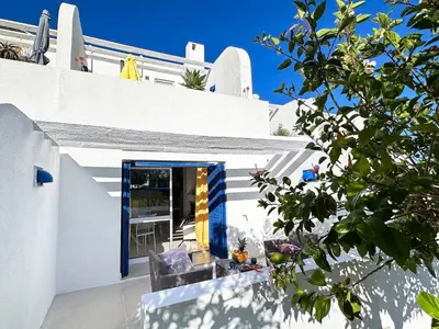 a white house with a blue door at Windmill Hill Cozy Townhouse by BeCherish in Albufeira