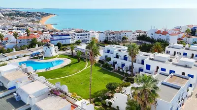 an aerial view of a resort with a pool and a beach at Windmill Hill Cozy Townhouse by BeCherish in Albufeira