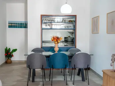 a dining room with a table and six chairs at Balaia Praia Apartment by Stay ici Algarve Holiday Rental in Albufeira