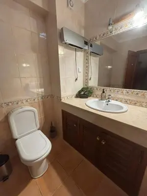 a bathroom with a toilet and a sink at V3 Villa in Albufeira in Albufeira