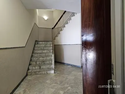 a staircase in a house with a stone floor at Blife Tonya - private rooms at Santantonya 1st floor in Faro