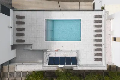 an aerial view of a building with a swimming pool at Terracos de Quarteira II Cherry by Real Properties in Quarteira