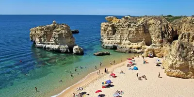a group of people on a beach near the ocean at Country villa in Algarve, 15 min from beach in Albufeira