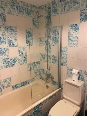 a bathroom with a sink and a shower and a tub at Marina Pool & Sea in Albufeira