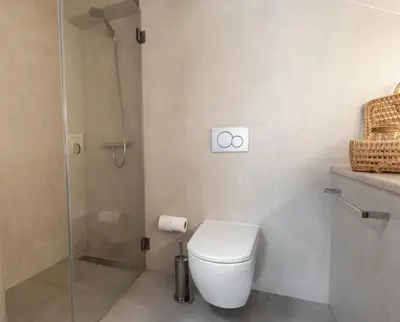 a bathroom with a toilet and a glass shower at Premium Apartment with Vilamoura Marina View in Vilamoura