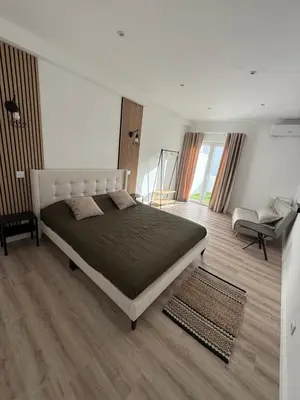 a bedroom with a large bed in a room at Camilas place in Faro