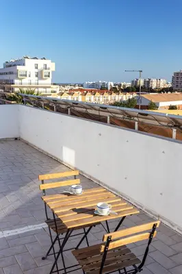 a couple of benches sitting on top of a roof at Blife Moustachya Villa in Faro