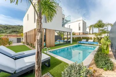 an image of a house with a swimming pool at Villa Memorias by Algarve Holidays in Páteo