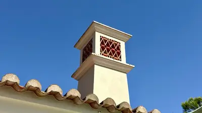 a clock tower on the top of a building at Belinha - PINHEIROS ALTOS in Ludo