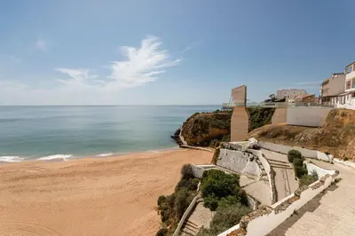 a view of a beach with buildings and the ocean at Budget Beach Center B5 in Albufeira