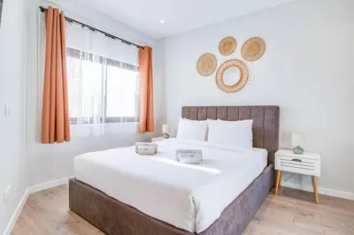 a bedroom with a large bed and a window at Stunning Ocean View Apt Beach 200mt AC Pool in Albufeira
