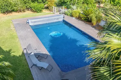 an overhead view of a swimming pool with a bench next to it at Luxury home in Albufeira in Albufeira