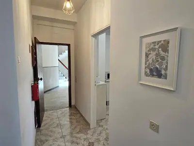 a hallway with a painting on the wall and a hallway with a hallway at Blife Brasilya - private rooms at Santantonya 2nd floor in Faro