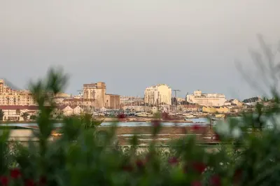 a view of a city with buildings in the background at Faro Luxury Home with Heated Pool and Garden in Faro