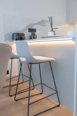 a kitchen with a table and chairs in a kitchen at The View at the Downtown 5 in Faro