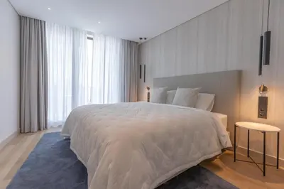 a kitchen and living room with a table and chairs at The View at the Downtown 5 in Faro