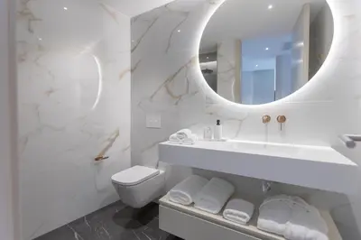 a bathroom with a sink and a mirror at The View at the Downtown 5 in Faro