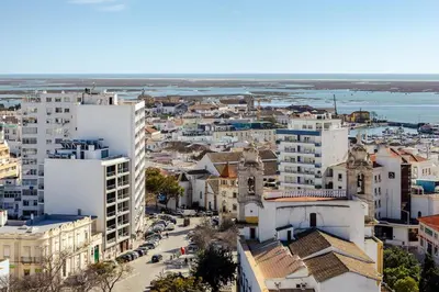 an aerial view of a city with buildings at The View at the Downtown 5 in Faro