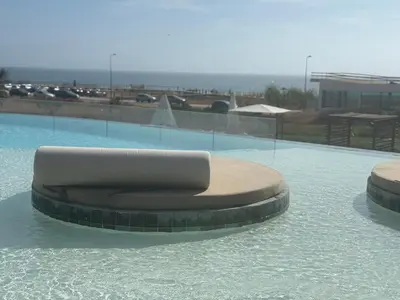 a circular object in the middle of a pool of water at Quarteira Horizon Sea in Quarteira
